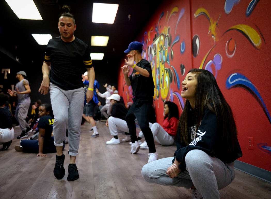 Jayna Hughes, 13, cheers on the male dancers as they practice a dance they are learning in a training class at Elevate Dance Center in Las Vegas, Tuesday, Feb. 19, 2019. (Caroline Brehman/Las Vega ...