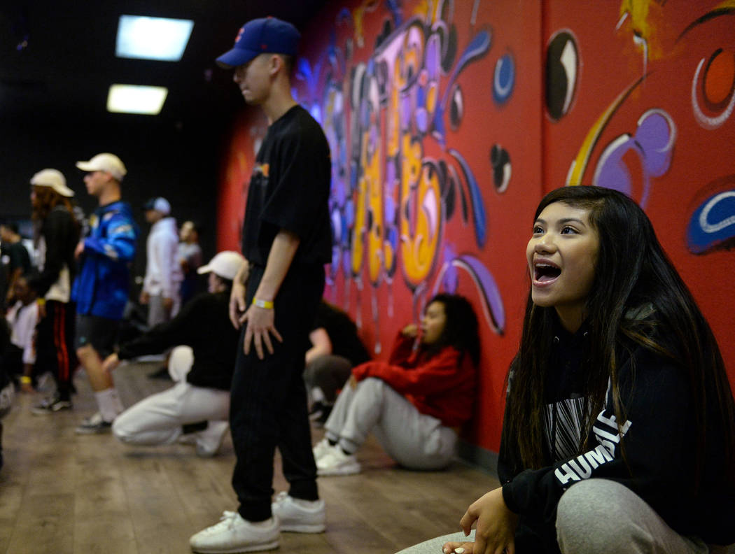 Jayna Hughes, 13, cheers on the male dancers as they practice a dance they are learning in a training class at Elevate Dance Center in Las Vegas, Tuesday, Feb. 19, 2019. (Caroline Brehman/Las Vega ...