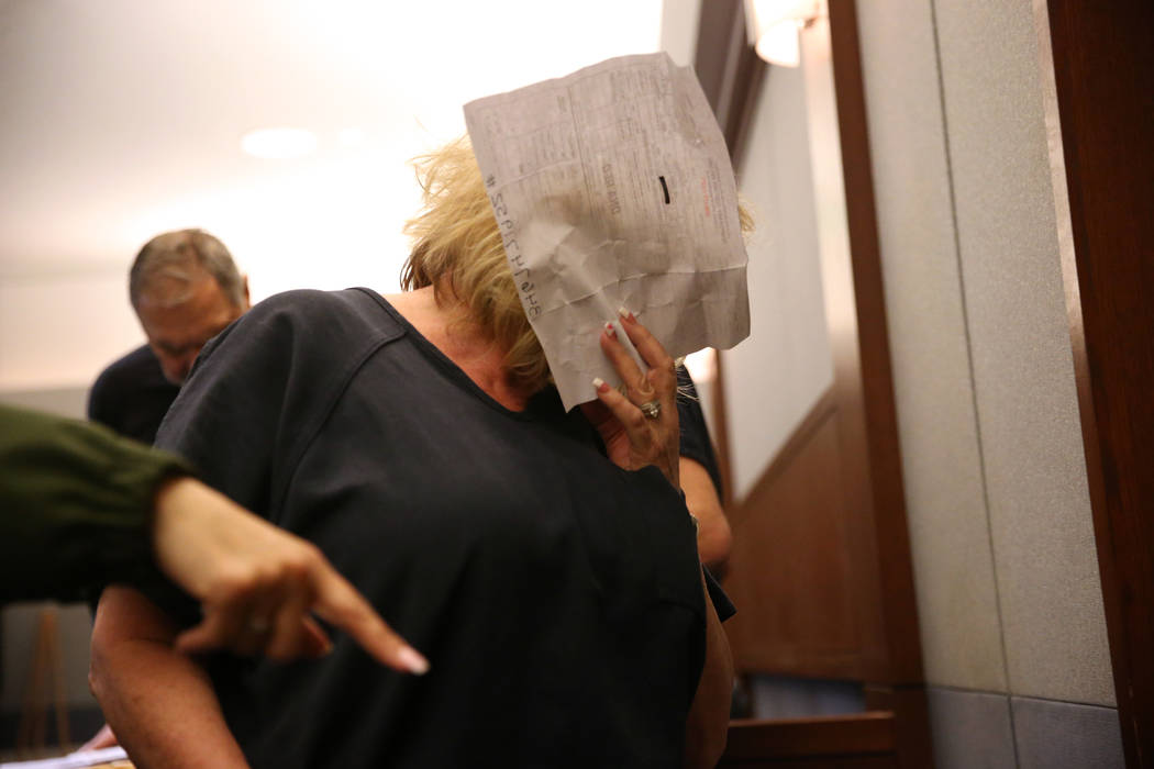 Patricia Chappuis is escorted out the court room following her case hearing at the Regional Justice Center in Las Vegas, Thursday, Feb. 14, 2019. Marcel Chappuis and his wife, Patricia, are operat ...