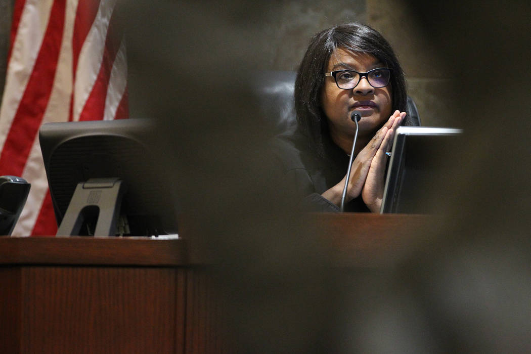 Judge Telia Williams listens to the court hearing for Patricia and husband Marcel Chappuis, not pictured, during a court hearing for his clients at the Regional Justice Center in Las Vegas, Thursd ...