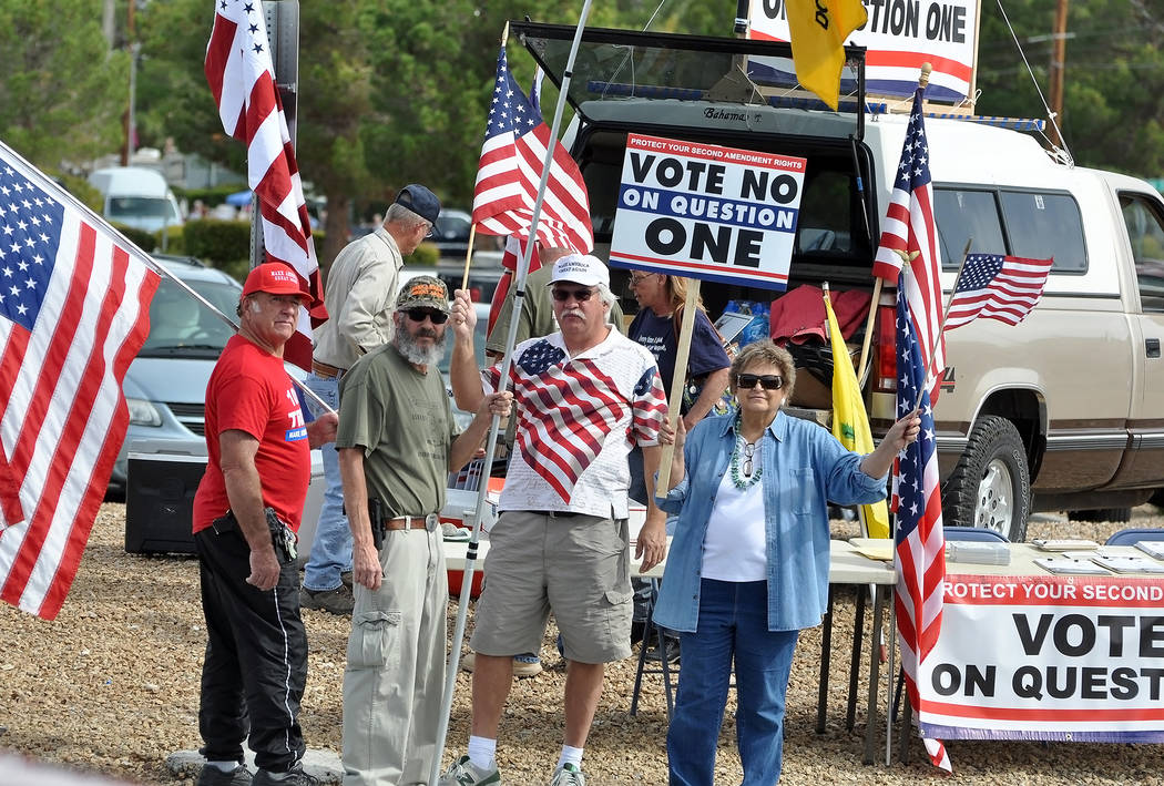 A “VOTE NO ON QUESTION 1” rally in Pahrump on Highway 160 in October. A new Nevada law requiring background checks for private party gun sales was deemed unenforceable Wednesday. Horace Langf ...