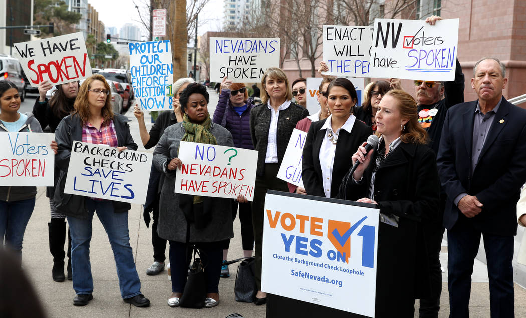 Elizabeth Becker of Nevada MOMs Demand Action speaks with supporters of Question 1 outside the Regional Justice Center in Las Vegas on Friday, Feb. 23, 2018. She called on Gov. Brian Sandoval and ...