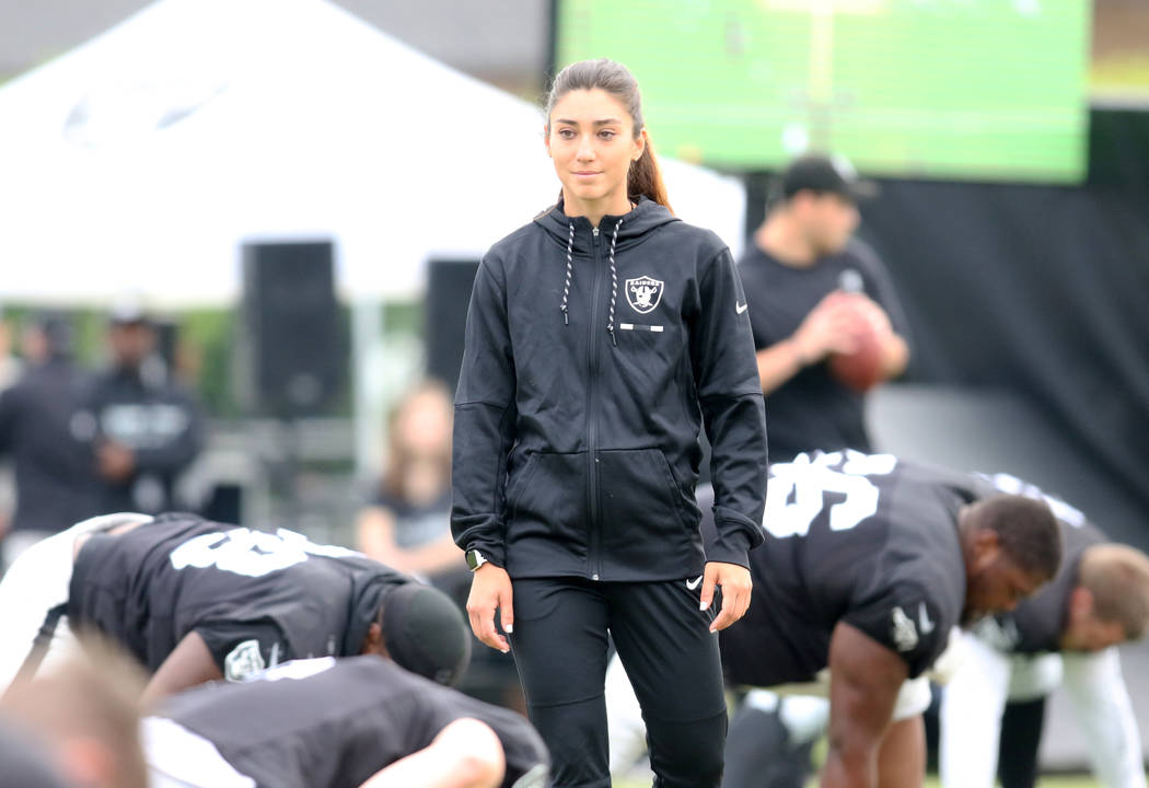 Oakland Raiders strength and conditioning assistant Kelsey Martinez oversees the warm up session at the team's NFL training camp in Napa, Calif., Wednesday, Aug. 8, 2018. Heidi Fang Las Vegas Revi ...