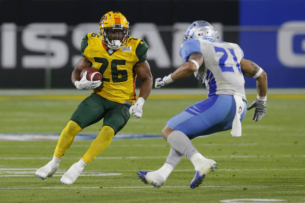 Arizona Hotshots running back Jhurell Pressley (26) runs in front of Salt Lake Stallions cornerback Cody Brown in the second half during an AAF football game Sunday, Feb. 10, 2019, in Tempe, Ariz. ...