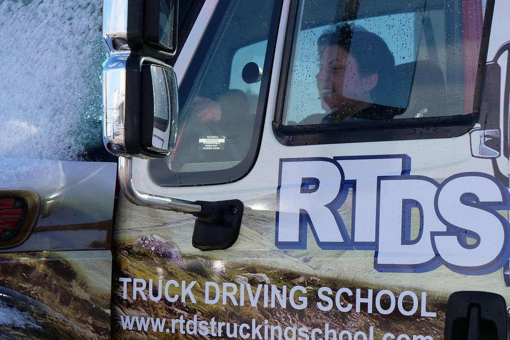 Christa Welther, student at RTDS Trucking School sits in a truck at the school in southwest Las Vegas on Monday, Feb. 18. RTDS Trucking School