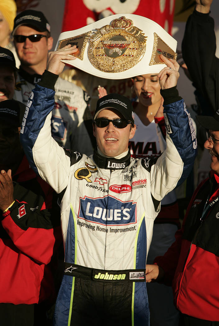 Jimmie Johnson celebrates with the trophy belt in winner's circle after winning the NASCAR Nextel Cup Series UAW-DaimlerChrysler 400 at Las Vegas Motor Speedway Sunday, March 12, 2006. (John Loche ...