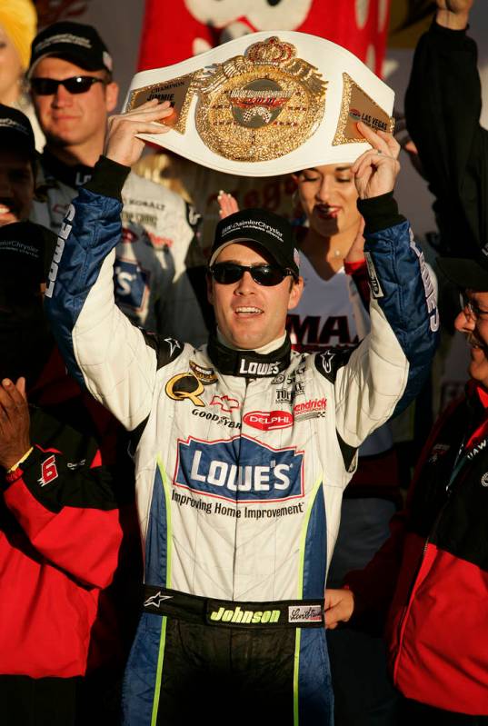 Jimmie Johnson celebrates with the trophy belt in winner's circle after winning the NASCAR Nextel Cup Series UAW-DaimlerChrysler 400 at Las Vegas Motor Speedway Sunday, March 12, 2006. (John Loche ...