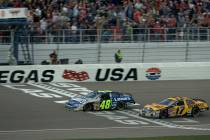 Jimmie Johnson takes the checkered flag a few feet ahead of Matt Kenseth in the NASCAR Nextel Cup UAW-DaimlerChrysler 400 at Las Vegas Motor Speedway Sunday, March 12, 2006. (K.M. Cannon/Las Vegas ...