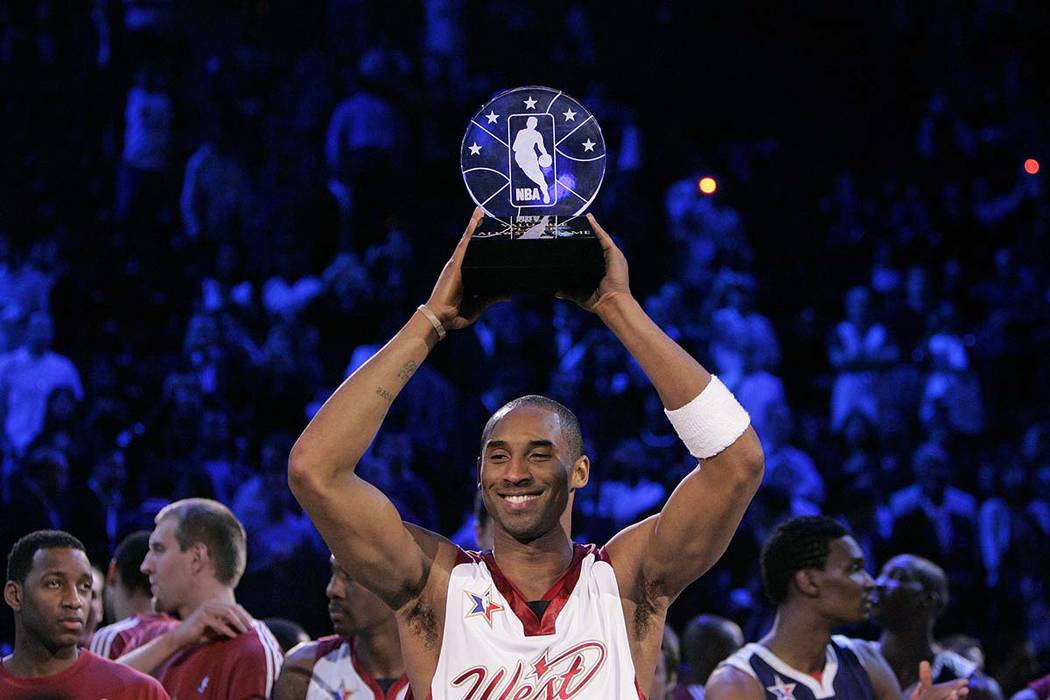 NBA Western Conference player Kobe Bryant holds up the Most Valuable Player trophy after it was awarded to him following the 2007 NBA All-Star Game Sunday, Feb. 18, 2007, in Las Vegas. (Las Vegas ...