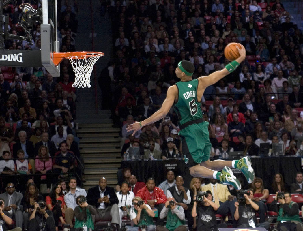 Gerald Green of the Boston Celtics flies over a table on his final dunk to win the Slam-dunk competition during NBA All-Star festivities at the Thomas & Mack Center Saturday, Feb. 17, 2007. (K ...