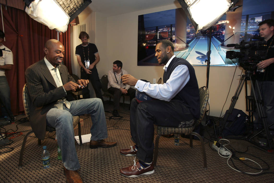 ESPN basketball commentator and former UNLV basketball player Greg Anthony, left, prepares to interview NBA Western Conference player LeBron James, who plays with the Cleveland Cavaliers, during a ...