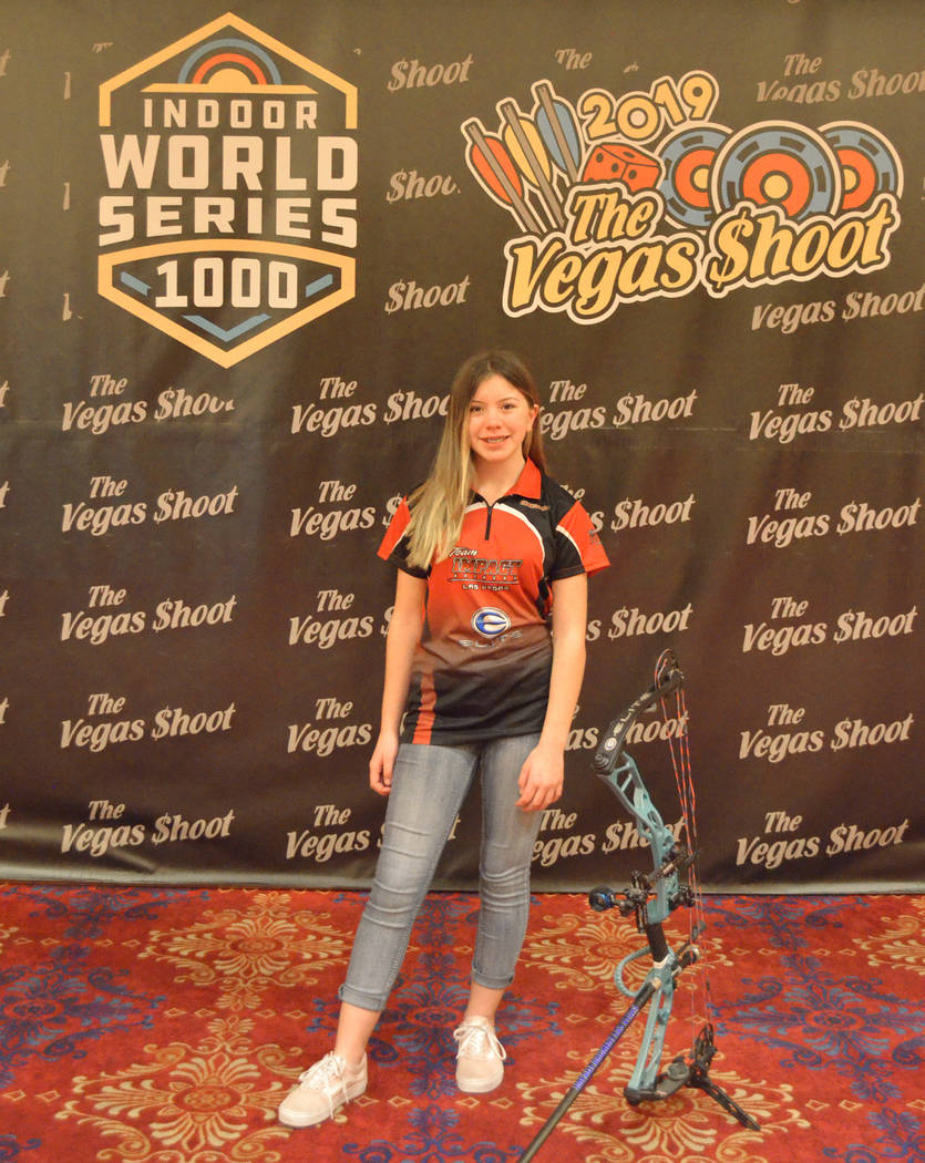 Haley West stands in front of the Vegas Shoot banner at the South Point. (Brenda West)