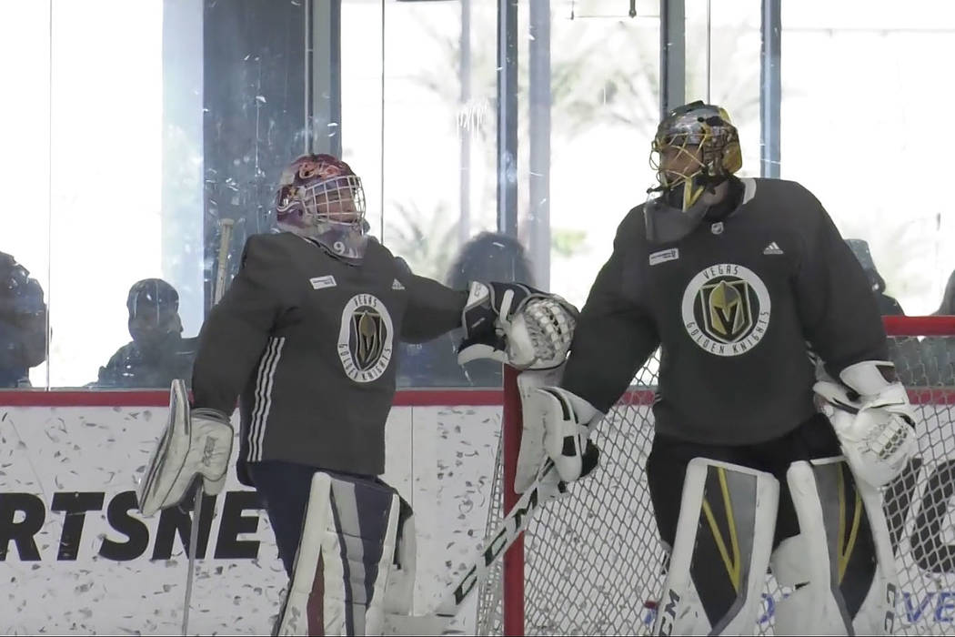 Vegas Golden Knights goaltender Marc-Andre Fleury, right, talks with honorary Golden Knights player Jay Procter, 12, during a practice at City National Arena in Las Vegas, Friday, Feb. 15, 2019. ( ...
