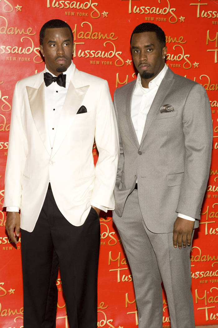 Sean "Diddy" Combs unveils his wax figure at Madame Tussauds in New York, Dec. 15, 2009. Police say someone attacked the statue of Combs at the wax museum, Saturday, Feb. 16, 2019, shoving the rap ...