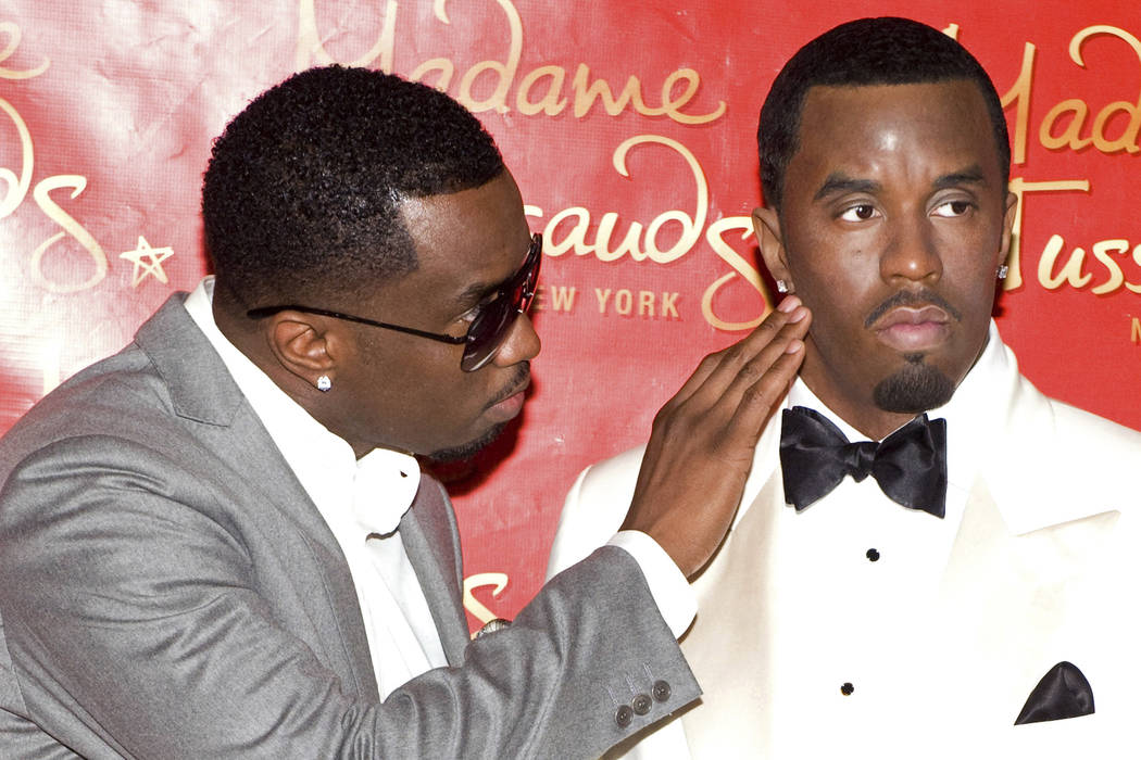 Sean "Diddy" Combs unveils his wax figure at Madame Tussauds in New York, Dec. 15, 2009. Police say someone attacked the statue of Combs at the wax museum, Saturday, Feb. 16, 2019, shoving the rap ...
