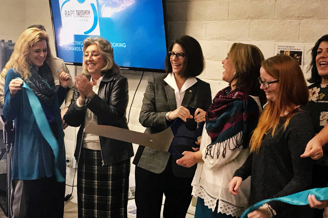 U.S. Sen. Catherine Cortez Masto, center, cuts the ribbon for the grand opening of the new, larger Rape Crisis Center office in Las Vegas on Tuesday, Feb. 19, 2019. The organization’s executive ...