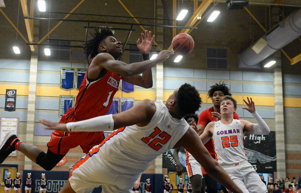 Coronado's Jaden Hardy (1) loses possession of the ball as Bishop Gorman's Max Allen (12) falls in front of him during the Desert Region boys semifinal game at Foothill High Schoo in Henderson, Tu ...