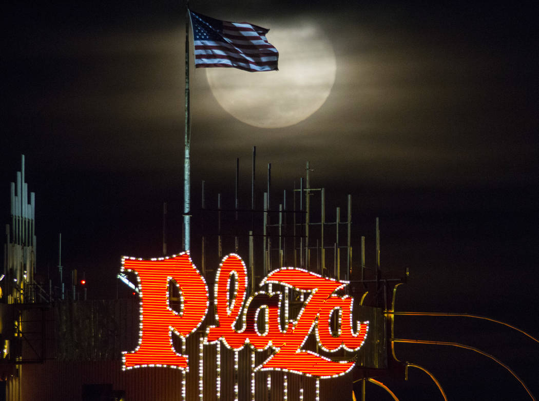 A super snow moon rises over the Plaza in downtown Las Vegas as seen from the World Market Cent ...