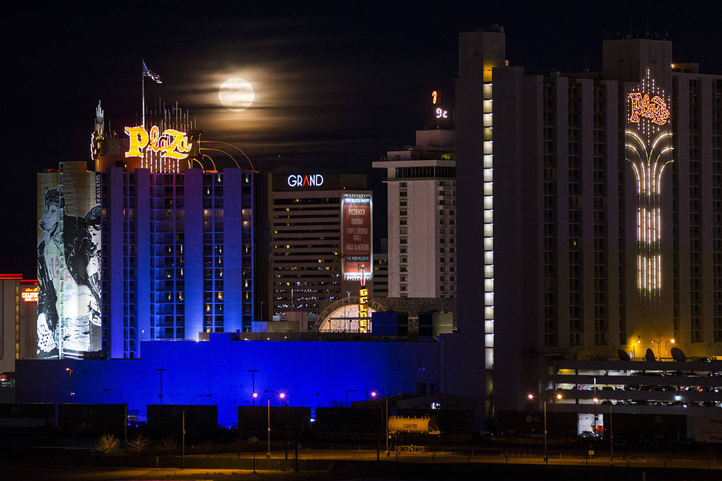 A super snow moon rises over the Plaza in downtown Las Vegas as seen from the World Market Center on Tuesday, Feb. 19, 2019. (Chase Stevens/Las Vegas Review-Journal) @csstevensphoto