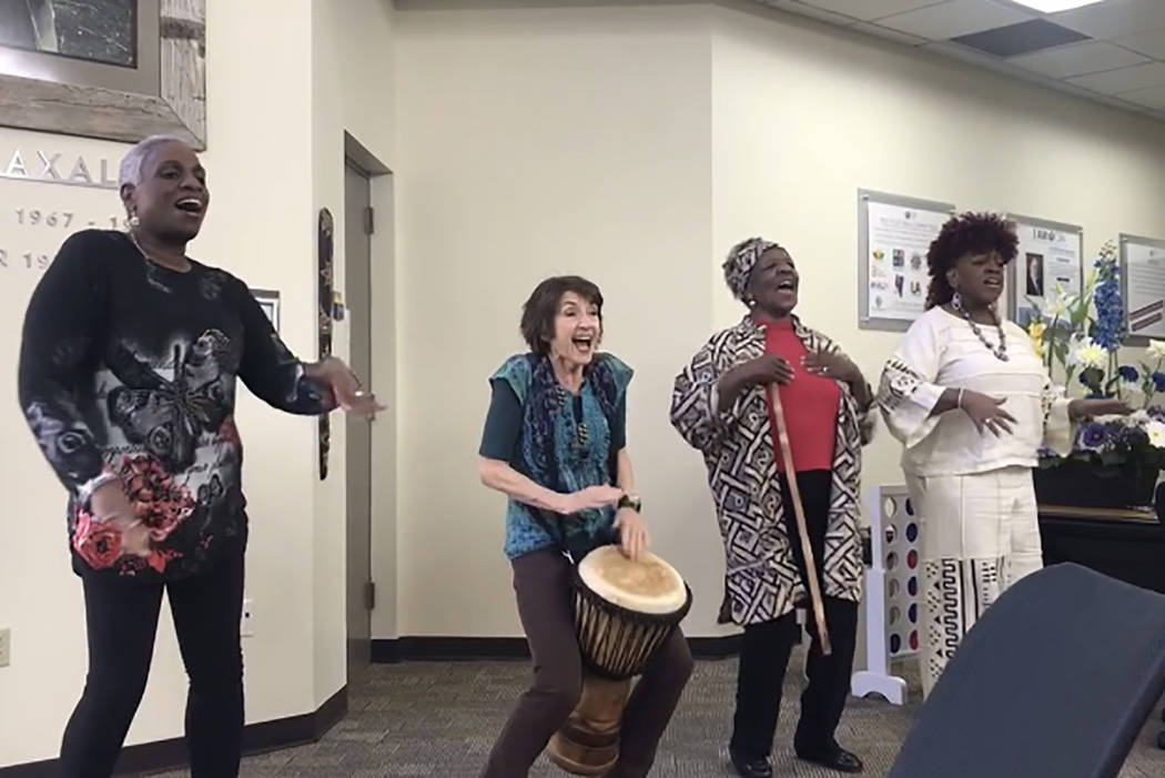 Rochelle Hooks, from left, president of the Nevada Writing Guild, leads a song alongside Karla Hunstman, Binnie Tate Wilkin and Judy-Ann Young at the “Stories from the Motherland” performance ...