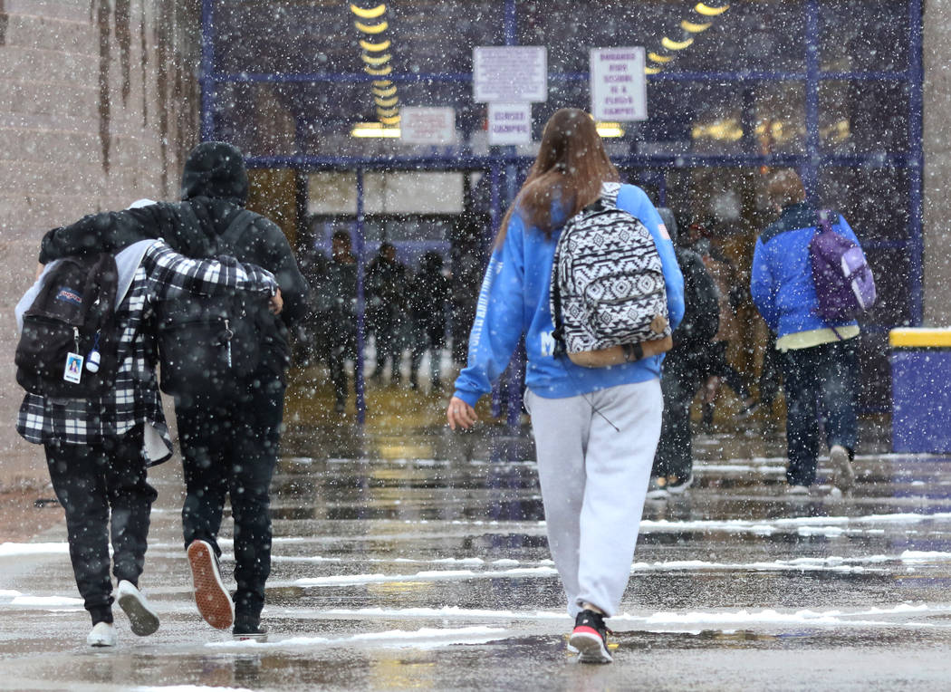 Durango High School students arrive at their school as snow continue to fall on Wednesday, Feb. 21, 2019. Bizuayehu Tesfaye Las Vegas Review-Journal @bizutesfaye