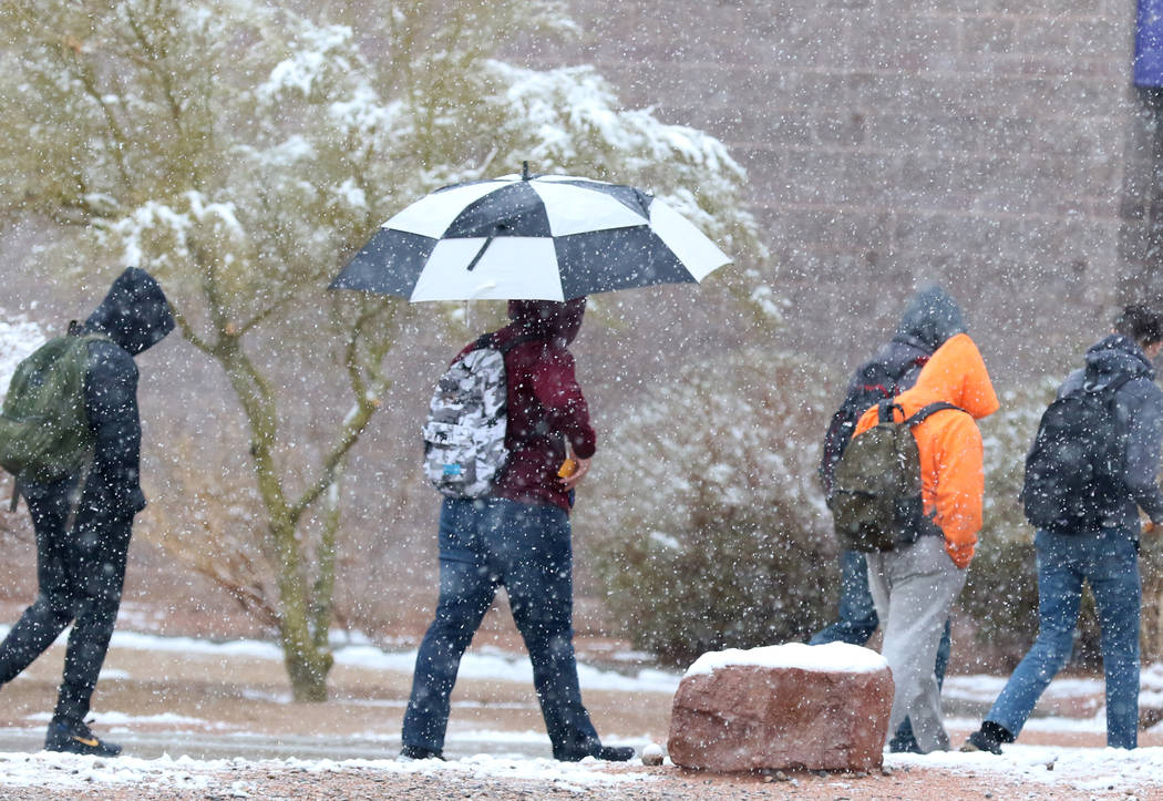 Durango High School students arrive at their school as snow continue to fall on Wednesday, Feb. 21, 2019. Bizuayehu Tesfaye Las Vegas Review-Journal @bizutesfaye