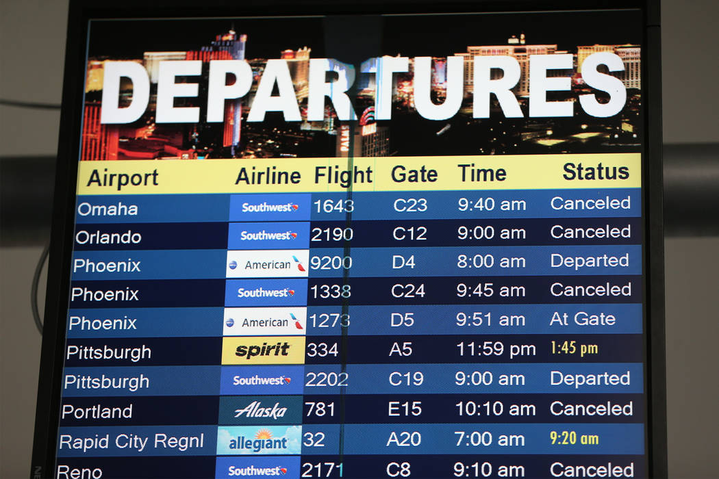 A flight departure screen shows canceled and delayed flights at McCarran International Airport Terminal 1 in Las Vegas, Thursday, Feb. 21, 2019. (Erik Verduzco/Las Vegas Review-Journal) @Erik_Verduzco