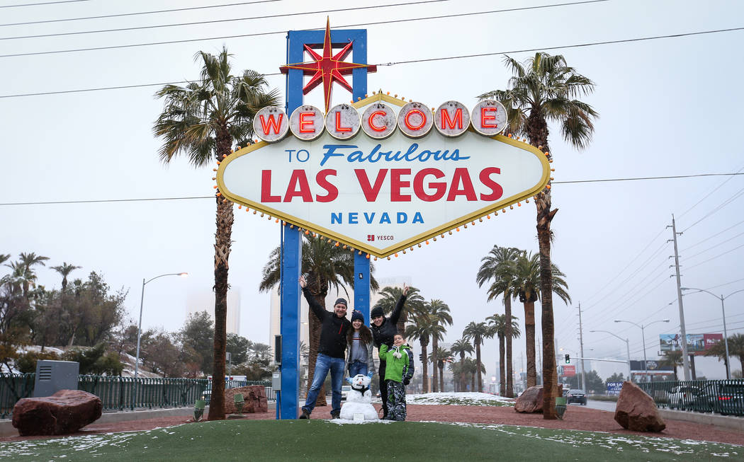 The Melendez family poses for a photograph in front of the Welcome to Fabulous Las Vegas sign in Las Vegas, Thursday, Feb. 21, 2019. (Caroline Brehman/Las Vegas Review-Journal) @carolinebrehman