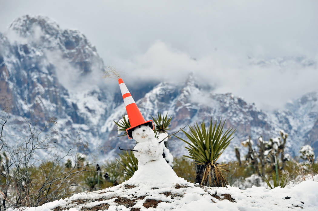 A snowman is capped with a traffic cone at the entrance at Red Rock Canyon National Conservation Area Thursday, Feb. 21, 2019, in Las Vegas. Las Vegas experienced its most significant snowfall in ...