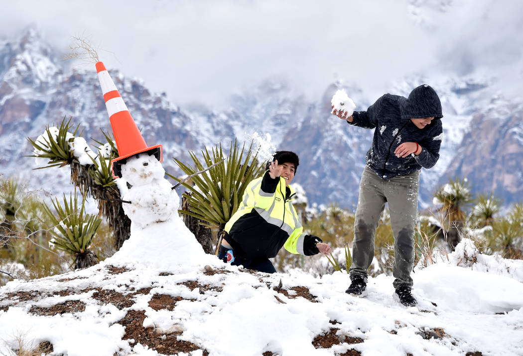Oscar Saenz, left, tosses a snowball at his brother Edgar Saenz while their family visited Red Rock Canyon National Conservation Area Thursday, Feb. 21, 2019, in Las Vegas. Las Vegas experienced i ...
