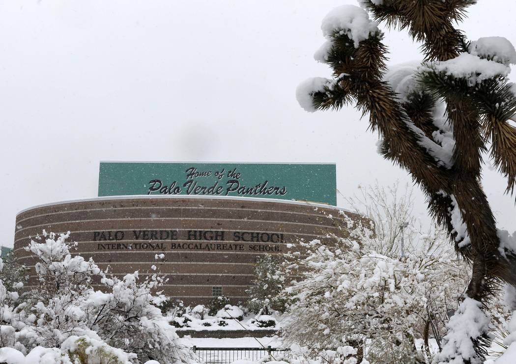 Snow falls in front of the entrance to Palo Verde High School in Las Vegas, Thursday, Feb. 21, 2019. (Heidi Fang /Las Vegas Review-Journal) @HeidiFang