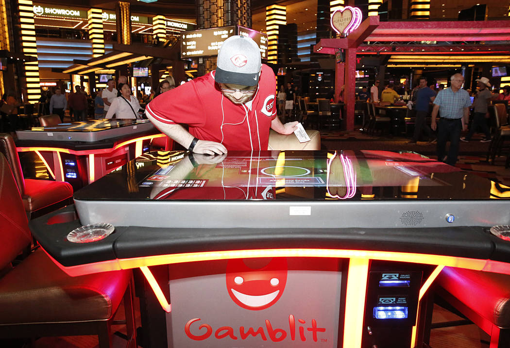 Aaron Hindel checks out the new gambling machine by skills-based company Gamblit at Planet Hollywood hotel-casino on Thursday, April 20, 2017, in Las Vegas. (Bizuayehu Tesfaye/Las Vegas Review-Jou ...