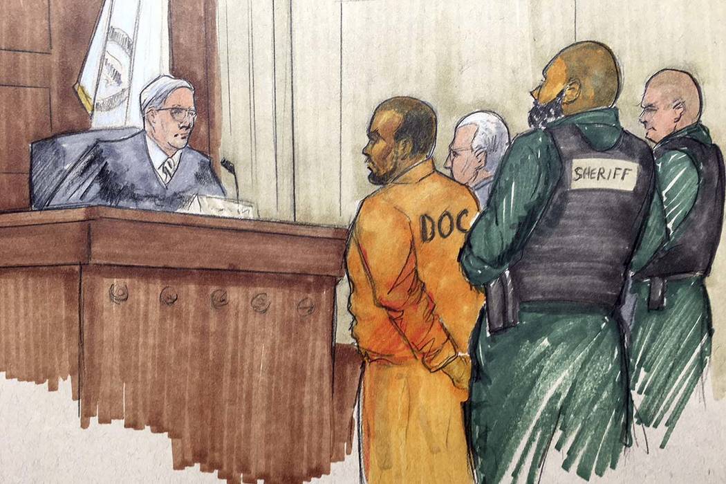 In this courtroom sketch, R&B singer R. Kelly appears before Cook County Associate Judge Lawrence Flood with his attorney Steve Greenberg Monday, Feb. 25, 2019, at the Leighton Criminal Courth ...