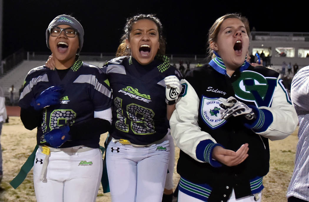 Green Valley's Anna Marie Arce, left, Justina Coronado and Sidney Rood cheer for their team during the final seconds of the Class 4A state flag football championship game against Bonanza at Cimarr ...