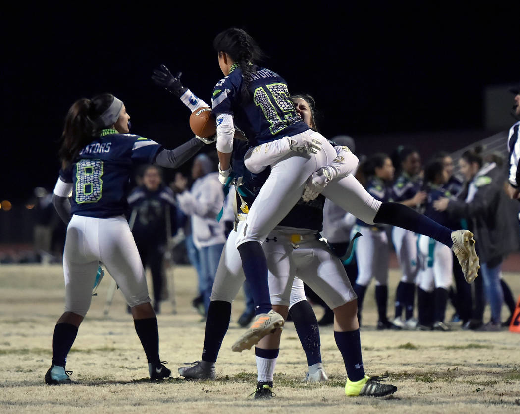 Green Valley's Jazlyn Camacho (15) is lifted into the air after completing the two-point conversion putting Green Valley ahead of Bonanza during Class 4A state flag football championship game at C ...