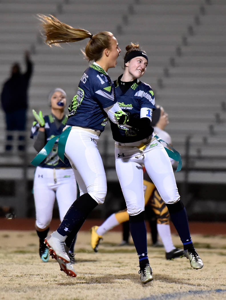 Green Valley's Nicolette De La Carrera (17) and Hailee McKay celebrate after the team scored a touchdown against Bonanza during Class 4A state flag football championship game at Cimarron High Scho ...