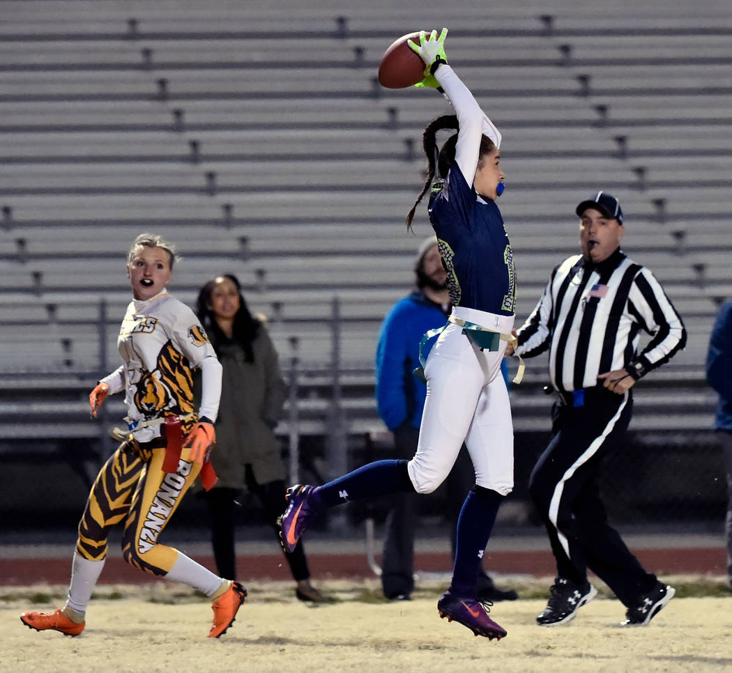 Green Valley's Rebecca Orozco (10) intercepts the all against Bonanza's Shayne Dunn (4) during Class 4A state flag football championship game at Cimarron High School Monday, Feb. 25, 2019, in Las ...