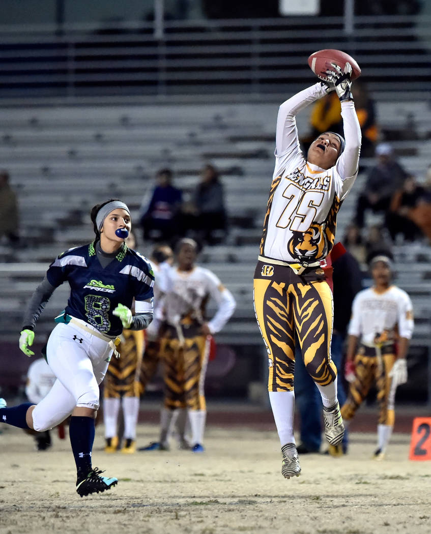Bonanza's Ashley Vasquez (75) makes a catch against Green Valley's Anna Grave de Peralta (8) during Class 4A state flag football championship game at Cimarron High School Monday, Feb. 25, 2019, in ...