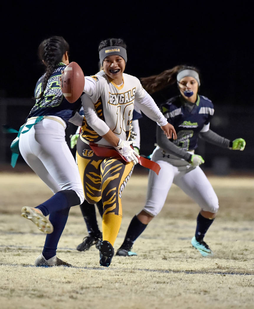 Bonanza's Cindylou Rasiang (18) carries the ball for a touchdown against Green Valley during Class 4A state flag football championship game at Cimarron High School Monday, Feb. 25, 2019, in Las Ve ...