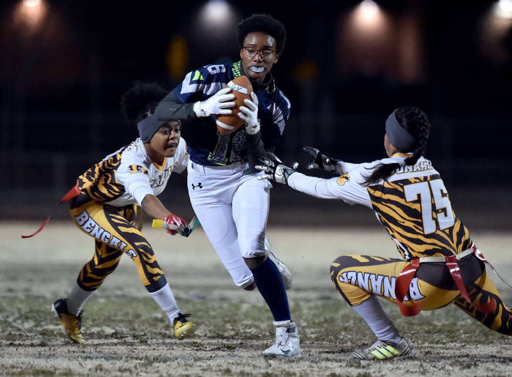 Green Valley's Deborah Grant (16) carries the ball against Bonanza during Class 4A state flag football championship game at Cimarron High School Monday, Feb. 25, 2019, in Las Vegas. Green Valley w ...
