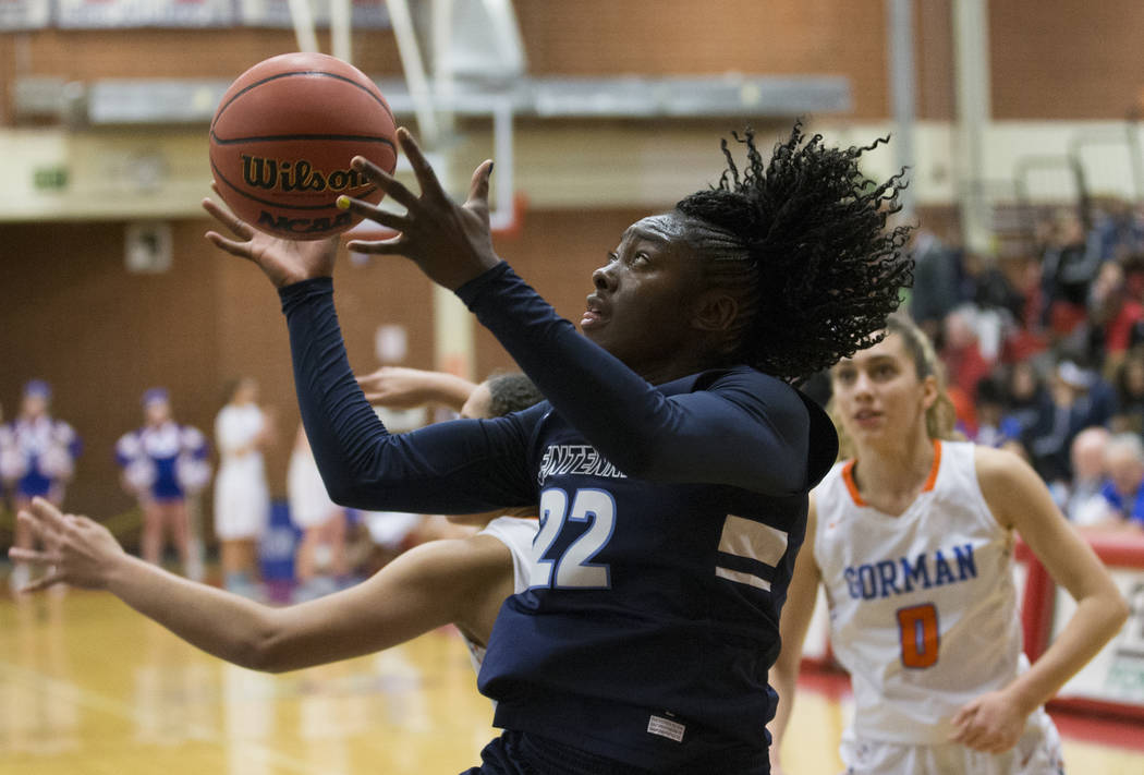Centennial senior Eboni Walker (22) drives baseline past Bishop Gorman sophomore Izzy Westbrook (0) in the fourth quarter during the Southern Nevada girls basketball championship game on Monday, F ...