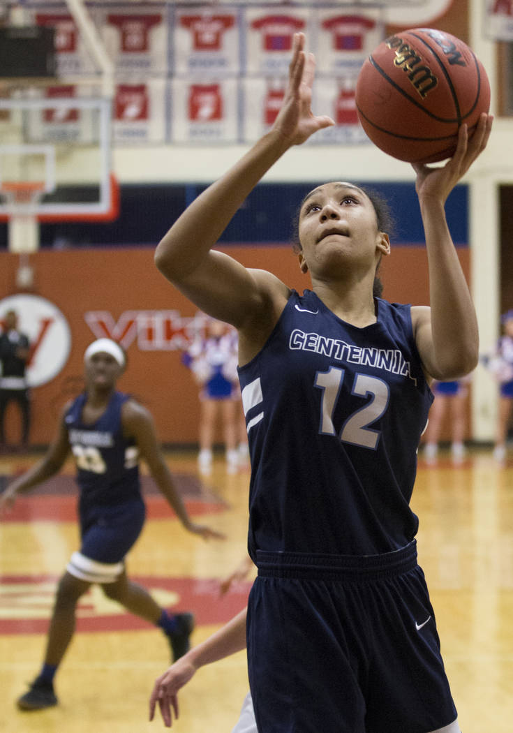 Centennial junior Aishah Brown (12) converts a fast-break layup in the fourth quarter during the Bulldogs game with Bishop Gorman during the Southern Nevada girls basketball championship game on M ...