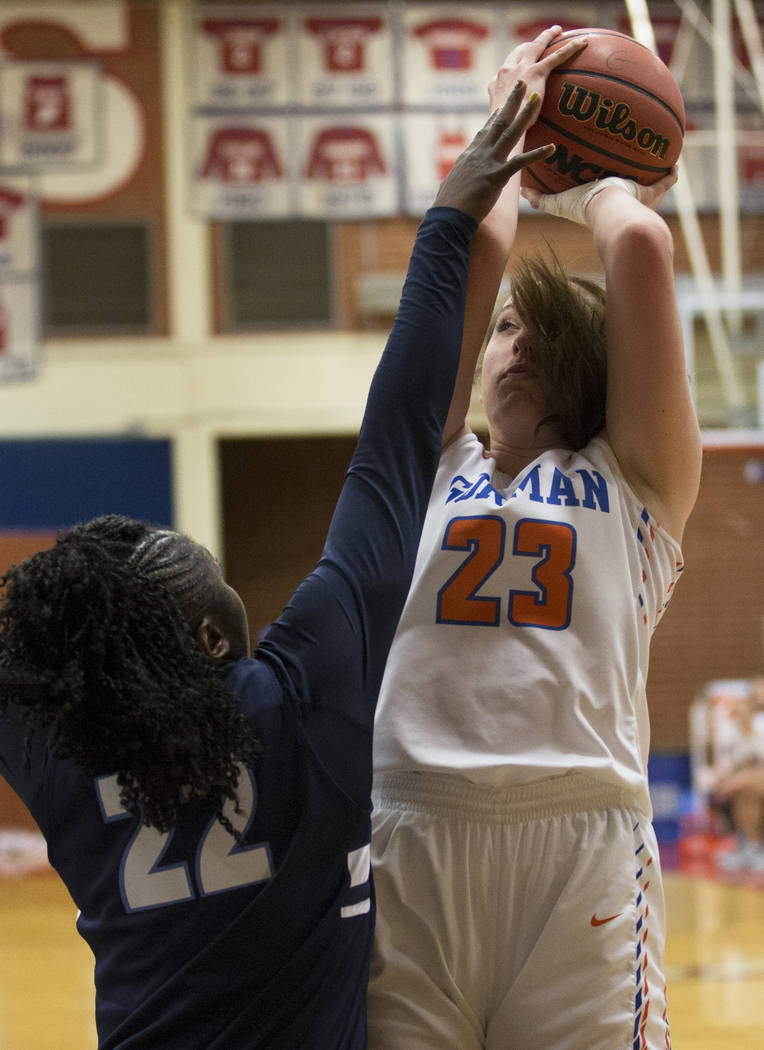Bishop Gorman senior Tierney Holcombe (23) shoots over Centennial senior Eboni Walker (22) in the second quarter during the Southern Nevada girls basketball championship game on Monday, Feb. 25, 2 ...