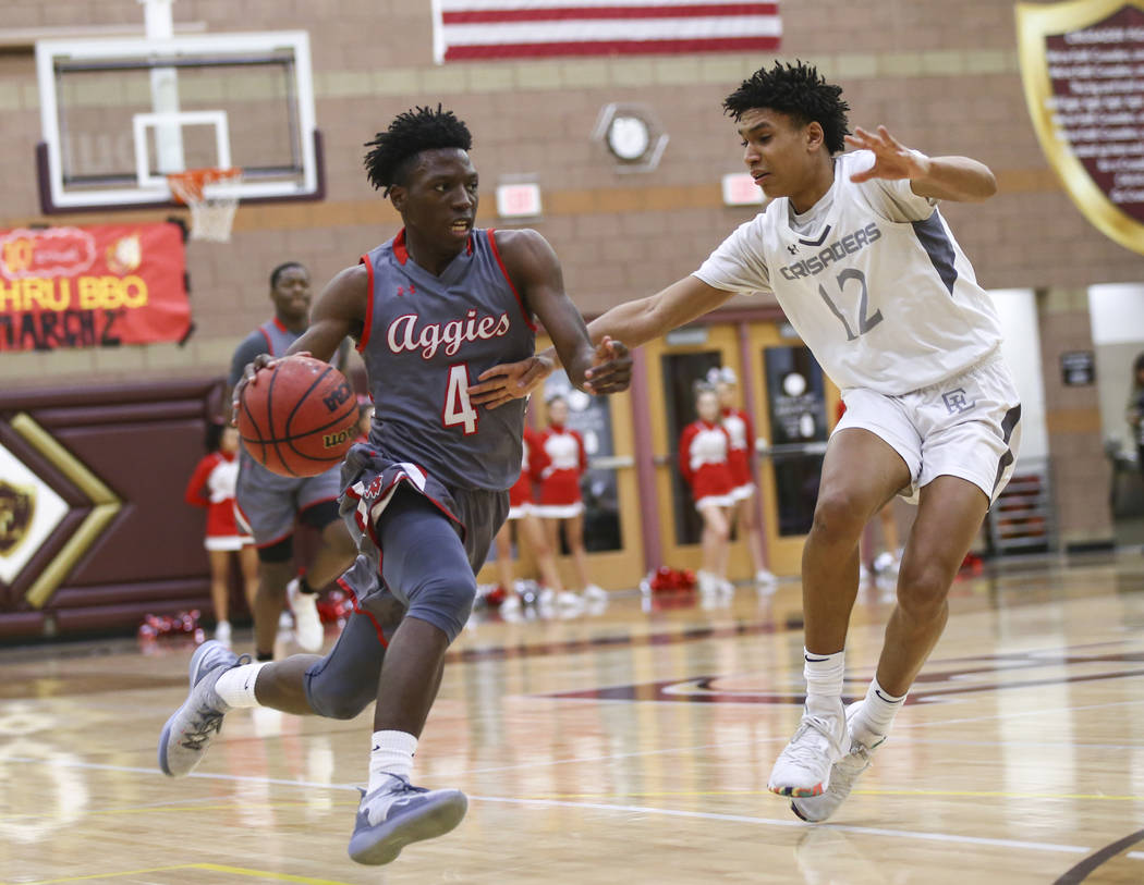 Arbor View's Tyre Williams (4) drives to the basket against Faith Lutheran's Jackson Williams (12) during the first half of a basketball game at Faith Lutheran High School in Las Vegas on Thursday ...