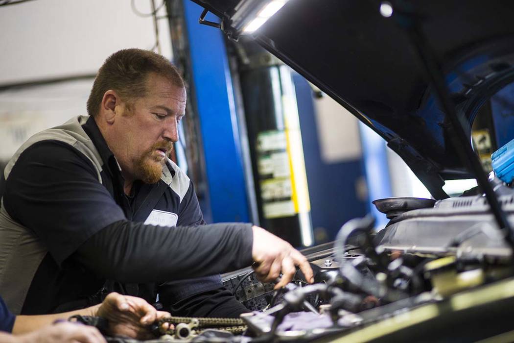 Paul's Auto Service assistant manager John Wright works on replacing a water pump at the auto shop in Las Vegas on Tuesday, Jan. 29, 2019. Chase Stevens Las Vegas Review-Journal @csstevensphoto