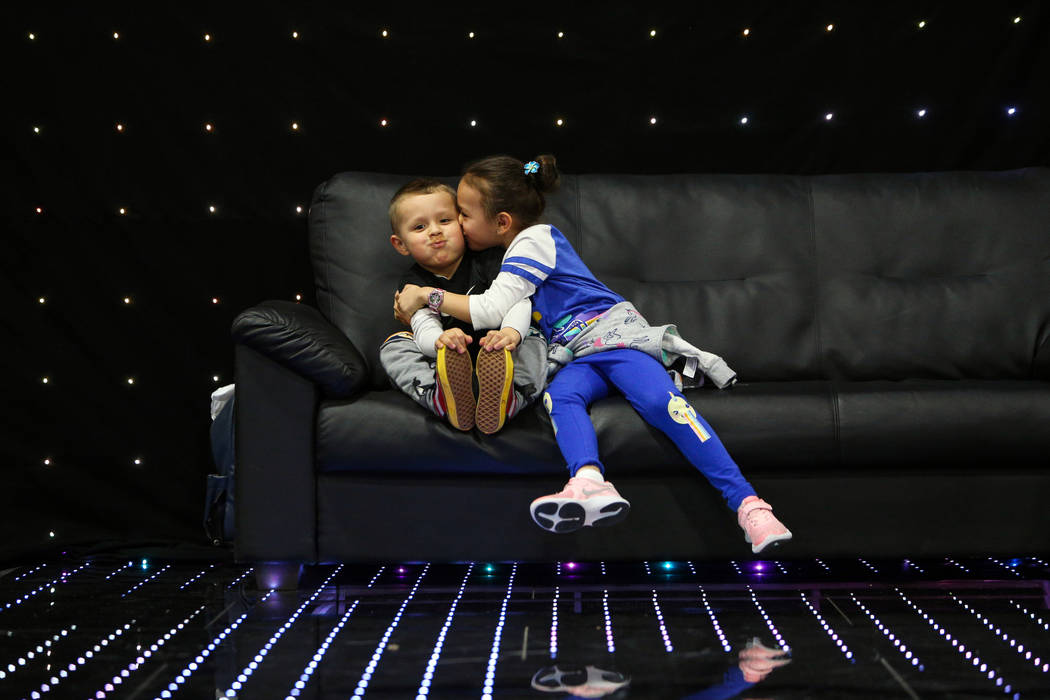 Ava Gamboa, 6, kisses her brother Jose Gamboa, 4, on the cheek at the at the Photo Booth Expo at the South Point Hotel and Casino in Las Vegas, Tuesday, Feb. 26, 2019. (Caroline Brehman/Las Vegas ...