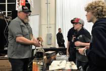 A group of young hunters listens intently while Al Morris, host of FOXPRO Hunting TV, shares the finer points of using an electronic game call to hail coyotes during the Western Hunting & Conserva ...