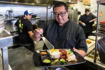 Flock & Fowl owner Chef Sheridan Su prepares Hainanese chicken rice with Mary's free-range chicken, chicken schmaltz rice, organic fried egg, Chinese sausage, cucumbers, pickled mustard, greens, g ...