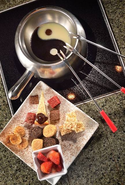 The Yin-Yang, featuring white and dark chocolate, is served at the Melting Pot at 8704 W. Charleston Blvd. The chocolate is served with brownies, bananas, cheesecake, strawberries and other treats ...