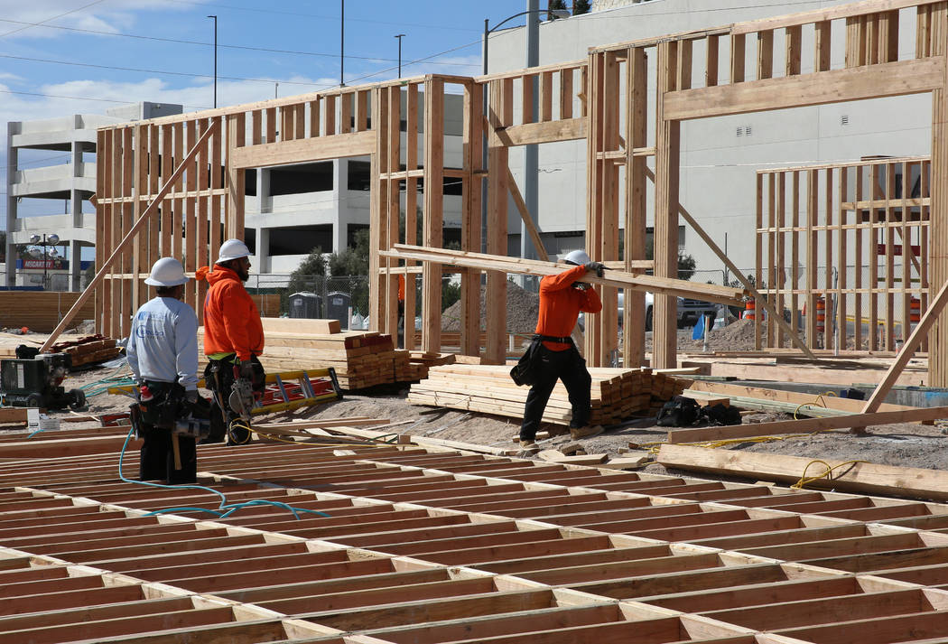 Workers are seen during the construction of Wahoo's Fish Taco at the mixed-use project under construction at Flamingo Road and Valley View Boulevard, next to the Palms on Wednesday, Feb. 27, 2019, ...